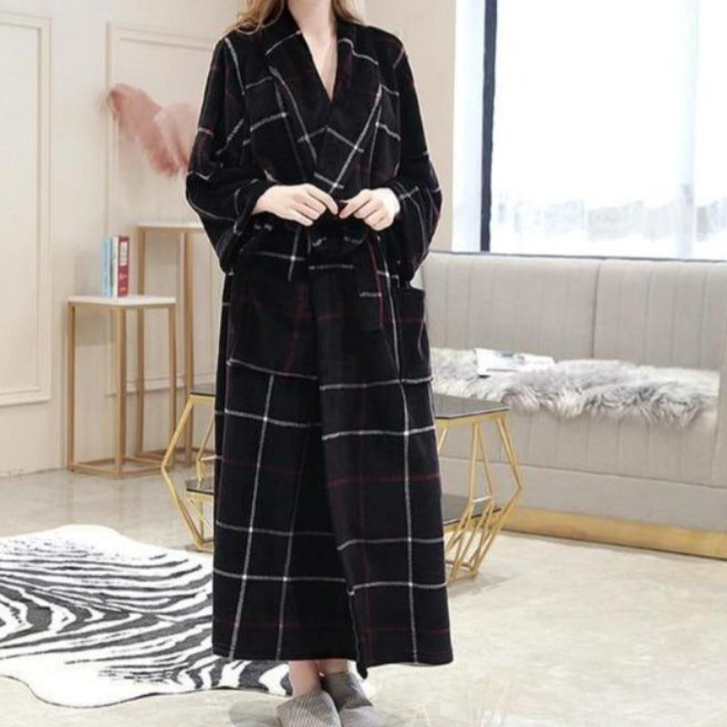 Woman in  black, blue and white long plaid spa bathrobe 