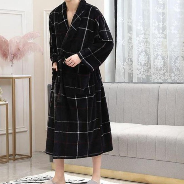 Man in black and white long plaid spa bathrobe 